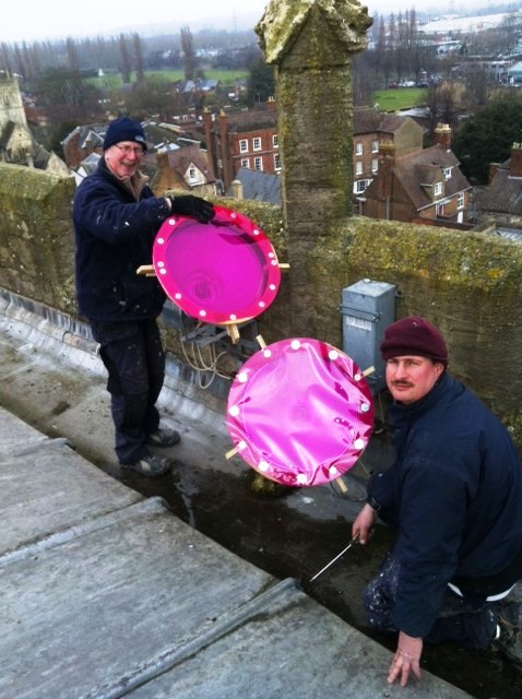 Cathedral team prepare to light the tower pink